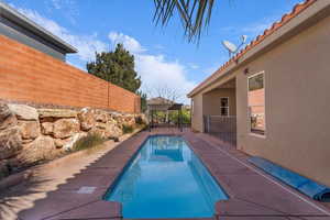 View of swimming pool featuring patio surround