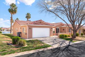 Mediterranean / spanish house featuring a garage, stucco siding, driveway, and a tiled roof