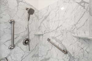Bathroom view of a marble finish shower