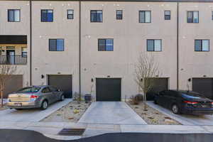 View of apartment building / complex featuring driveway