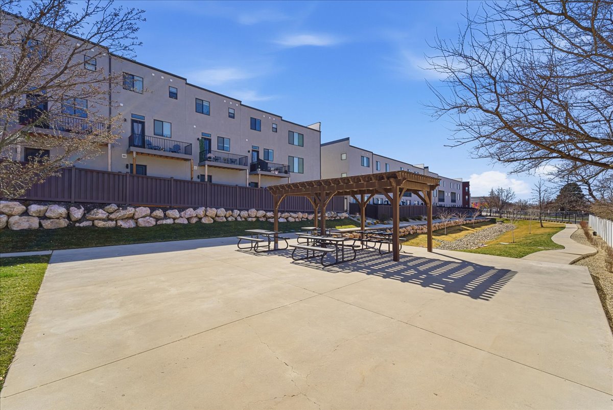 Surrounding community with a pergola and a patio area