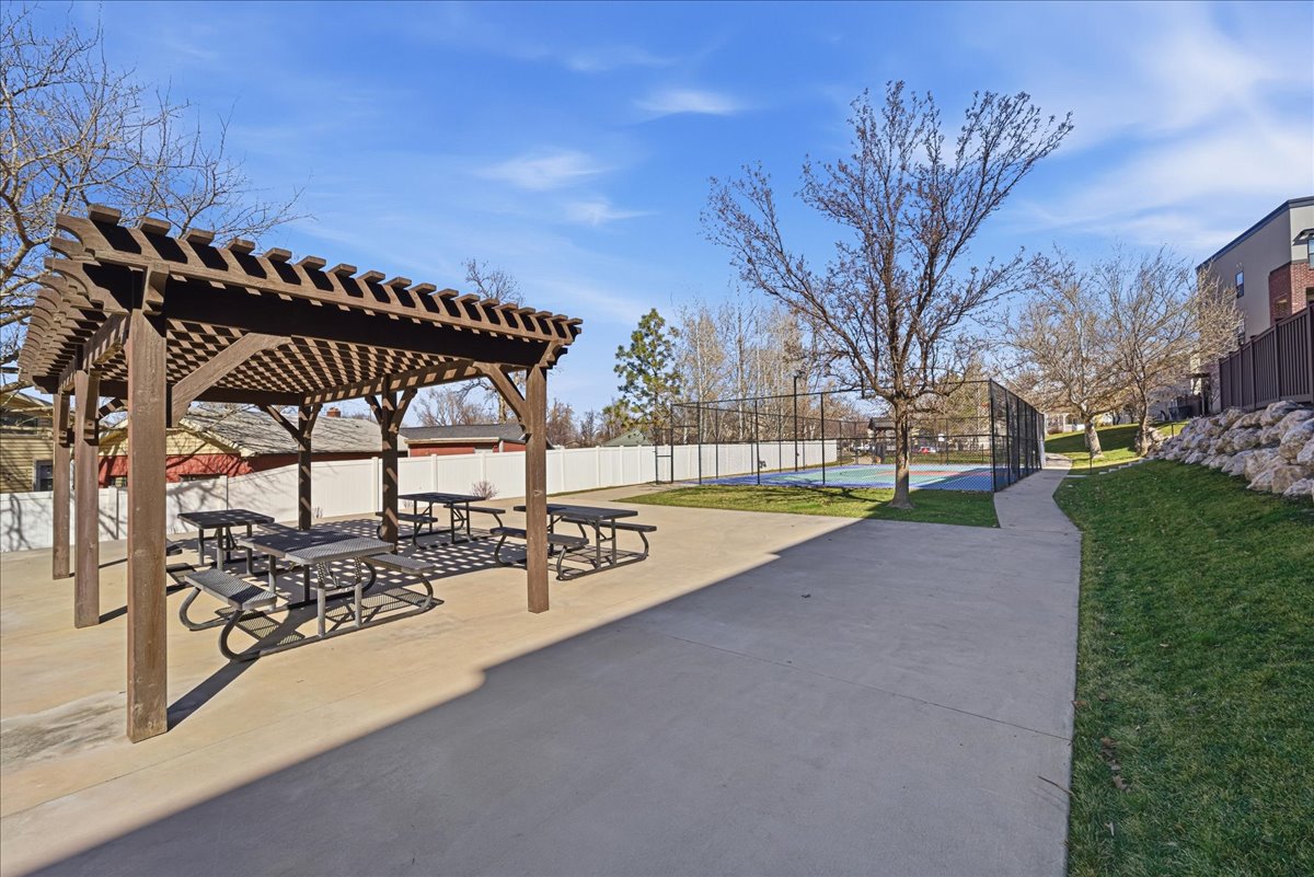 View of property's community with a patio area and a pergola