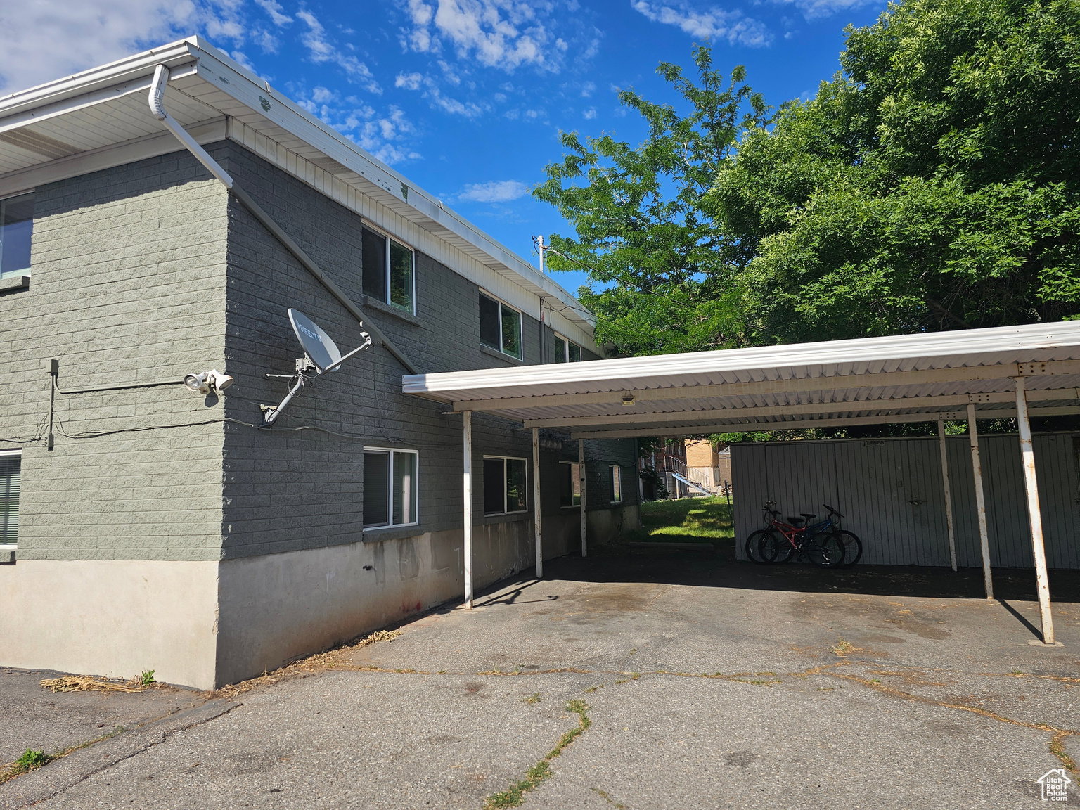 View of property exterior with brick siding