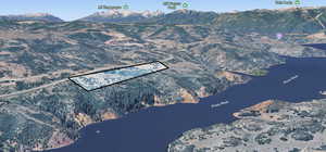 View of mountain backdrop featuring a large body of water