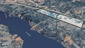 View of property location with a nearby body of water