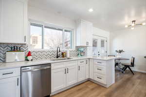 Kitchen with light stone counters and plenty of natural light