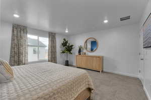 Bedroom featuring recessed lighting and carpet flooring