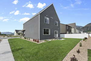 Rear view of house with a mountain view and stucco siding