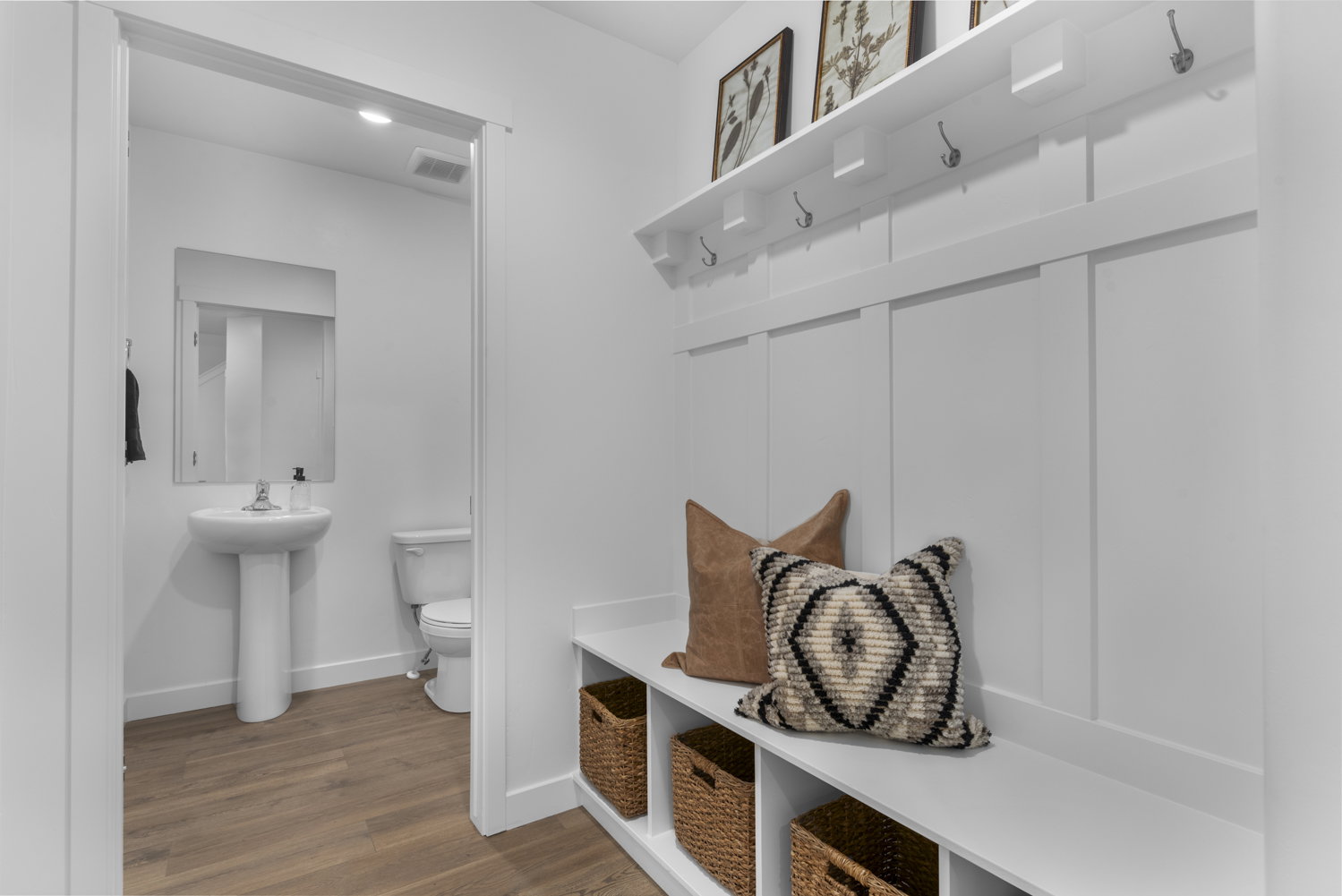 Mudroom with baseboards and wood finished floors