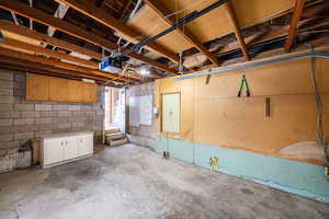 Garage with concrete block wall and a garage door opener