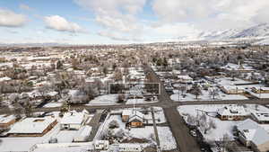 Snowy aerial view featuring a residential view