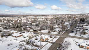 Snowy aerial view featuring a residential view