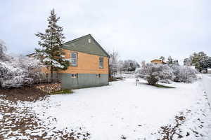 Back of property featuring brick siding