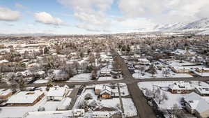 Snowy aerial view with a residential view