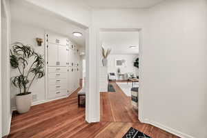 Entry with hardwood / wood-style flooring and baseboards