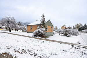 Back of property with a chimney
