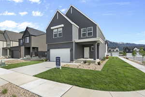 View of front of property with a residential view, a garage, stucco siding, concrete driveway, and a front lawn