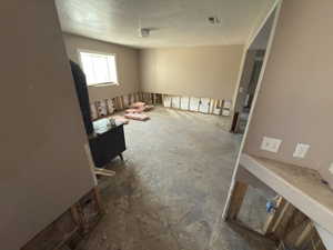 Empty room with a textured ceiling