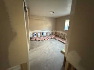 Empty room with a textured ceiling