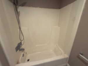 Full bath featuring shower / tub combination