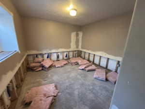 Empty room featuring a textured ceiling