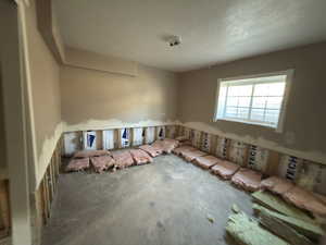 Spare room with a textured ceiling