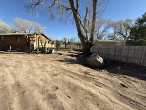 View of yard with a wooden deck