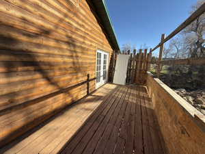 Wooden terrace featuring french doors