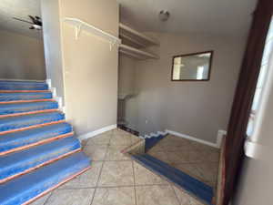 Stairway featuring tile patterned flooring