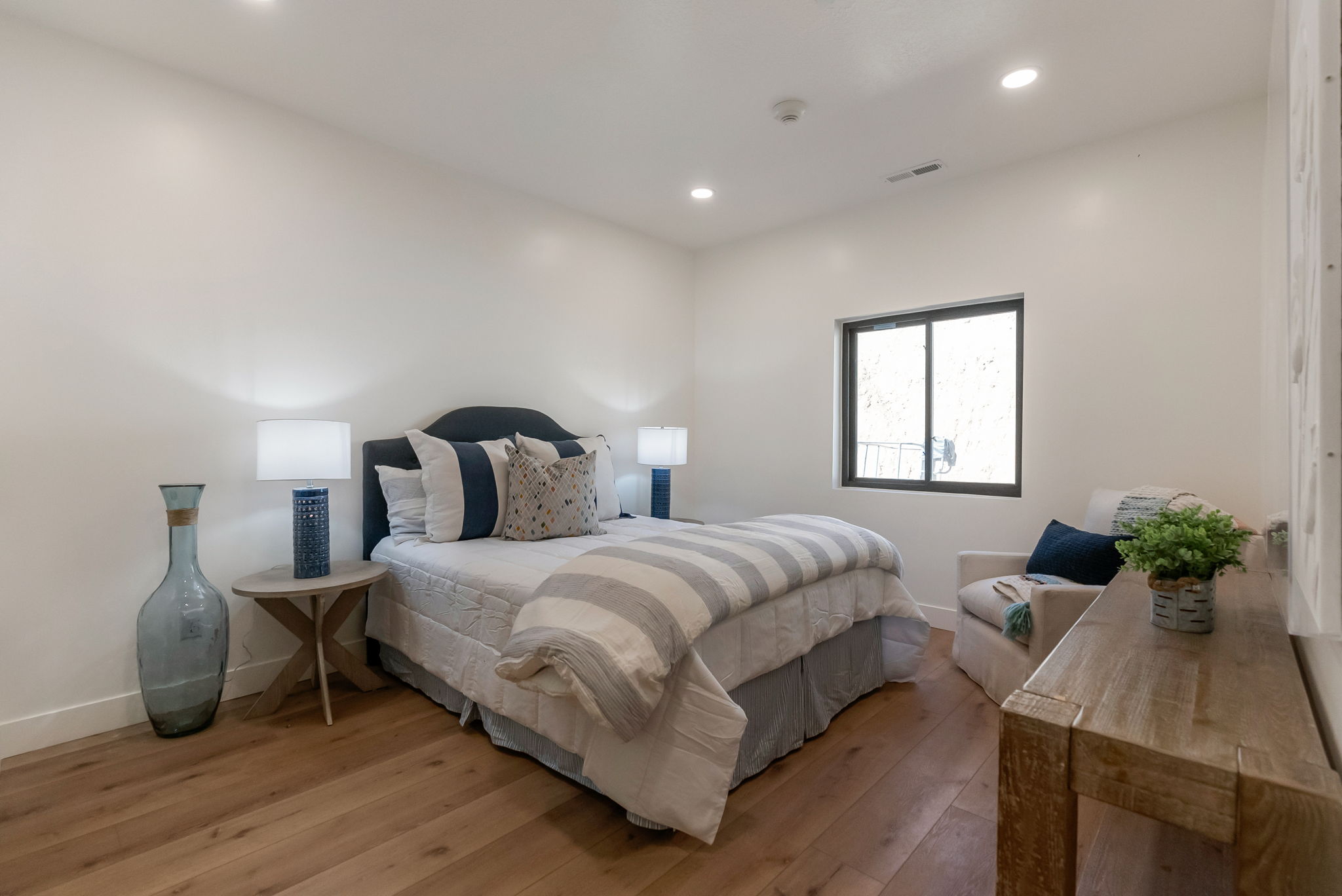 Bedroom featuring hardwood / wood-style flooring and recessed lighting