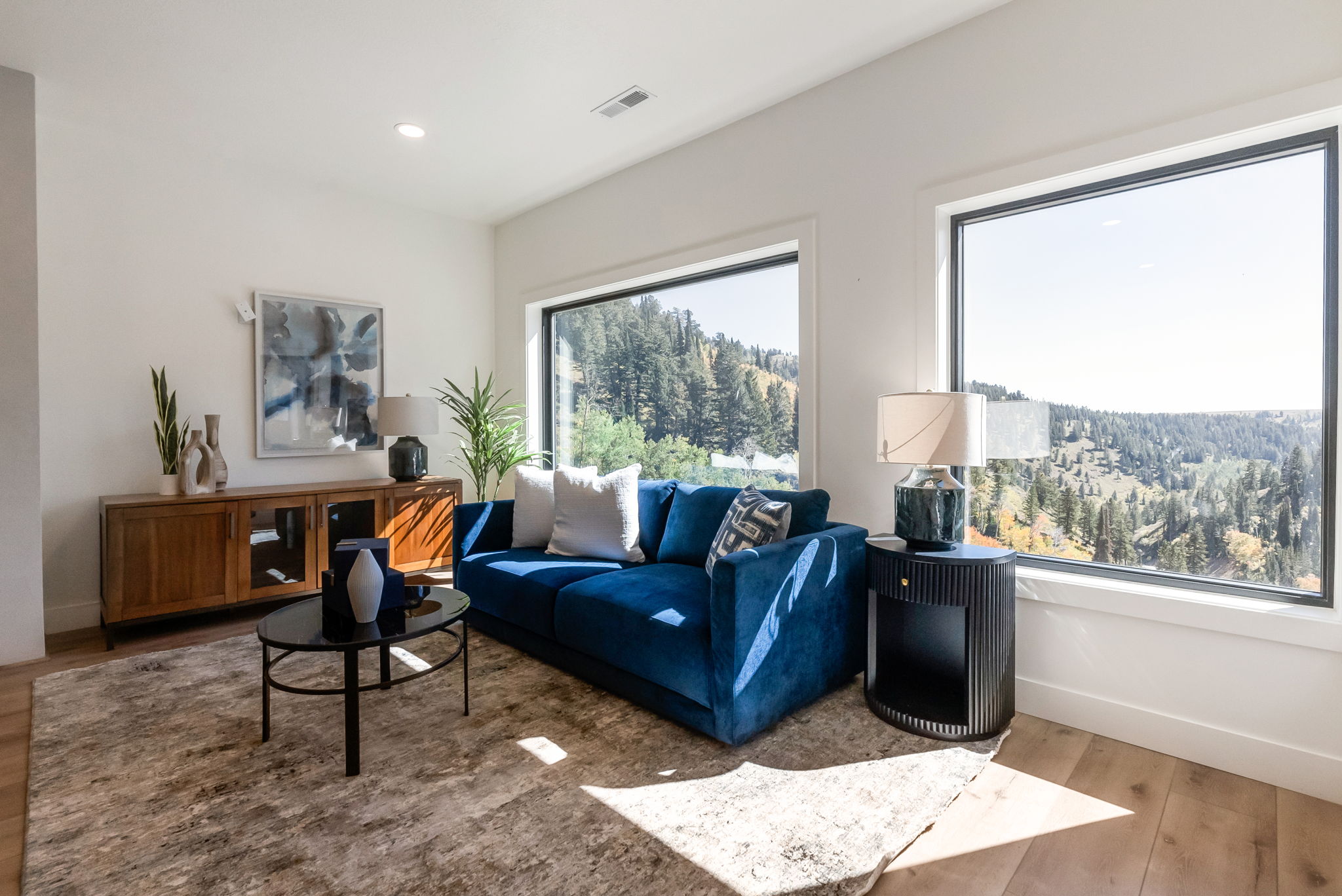Living area with wood finished floors and recessed lighting
