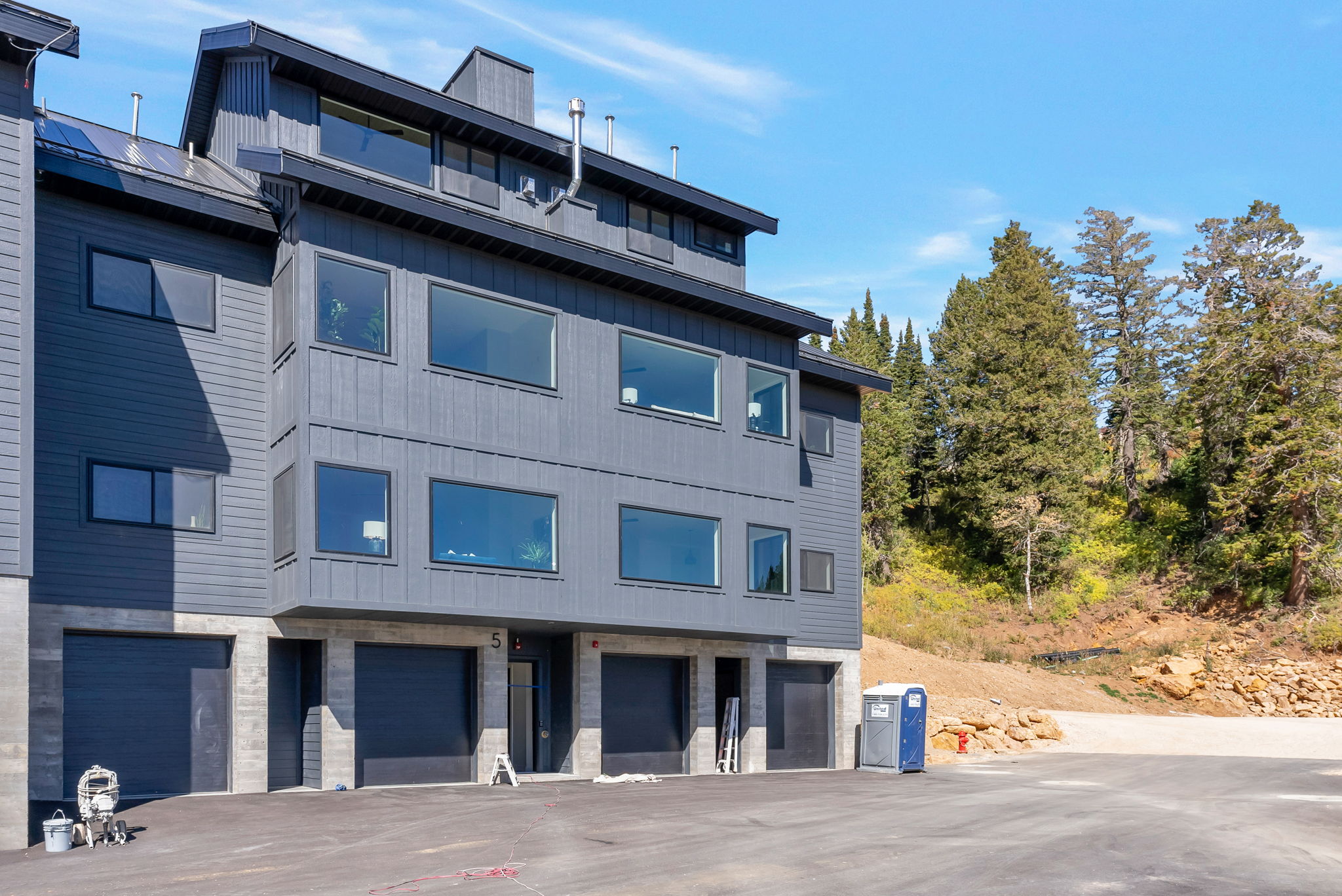 View of apartment building / complex with a garage