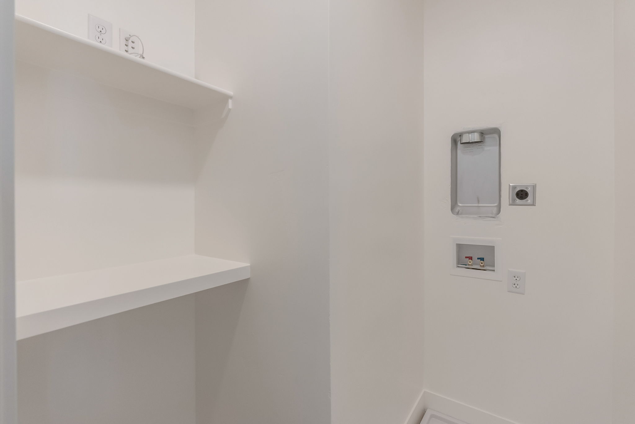 Laundry room featuring washer hookup and electric dryer hookup