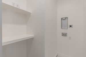 Laundry room featuring washer hookup and electric dryer hookup