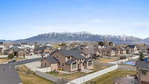 View of mountain backdrop featuring nearby suburban area