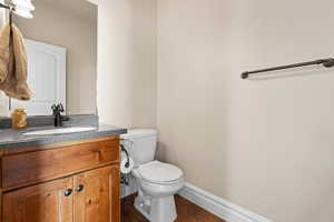 Bathroom with vanity and dark wood finished floors