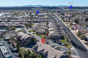 Aerial view of residential area featuring mountains