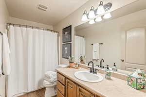 Bathroom featuring vanity and a shower with curtain