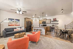 Living room with beverage cooler and a ceiling fan