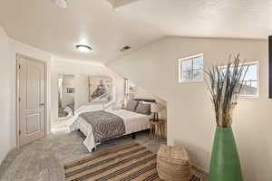 Carpeted bedroom with baseboards