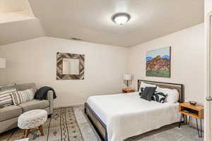 Bedroom featuring carpet flooring and baseboards