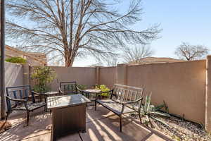 Fenced backyard featuring a patio area