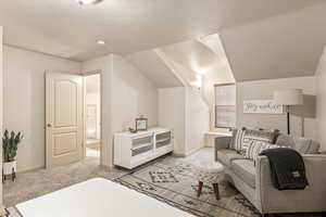 Bedroom featuring light colored carpet and baseboards