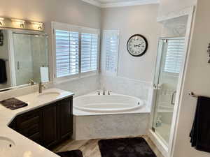 Primary Full Bath #1.  Double sinks, jetted corner tub, separate showing