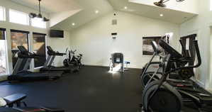 Workout area featuring recessed lighting and vaulted ceiling
