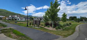 Looking West over common area of grass in front of lot 76 with Mountain background.