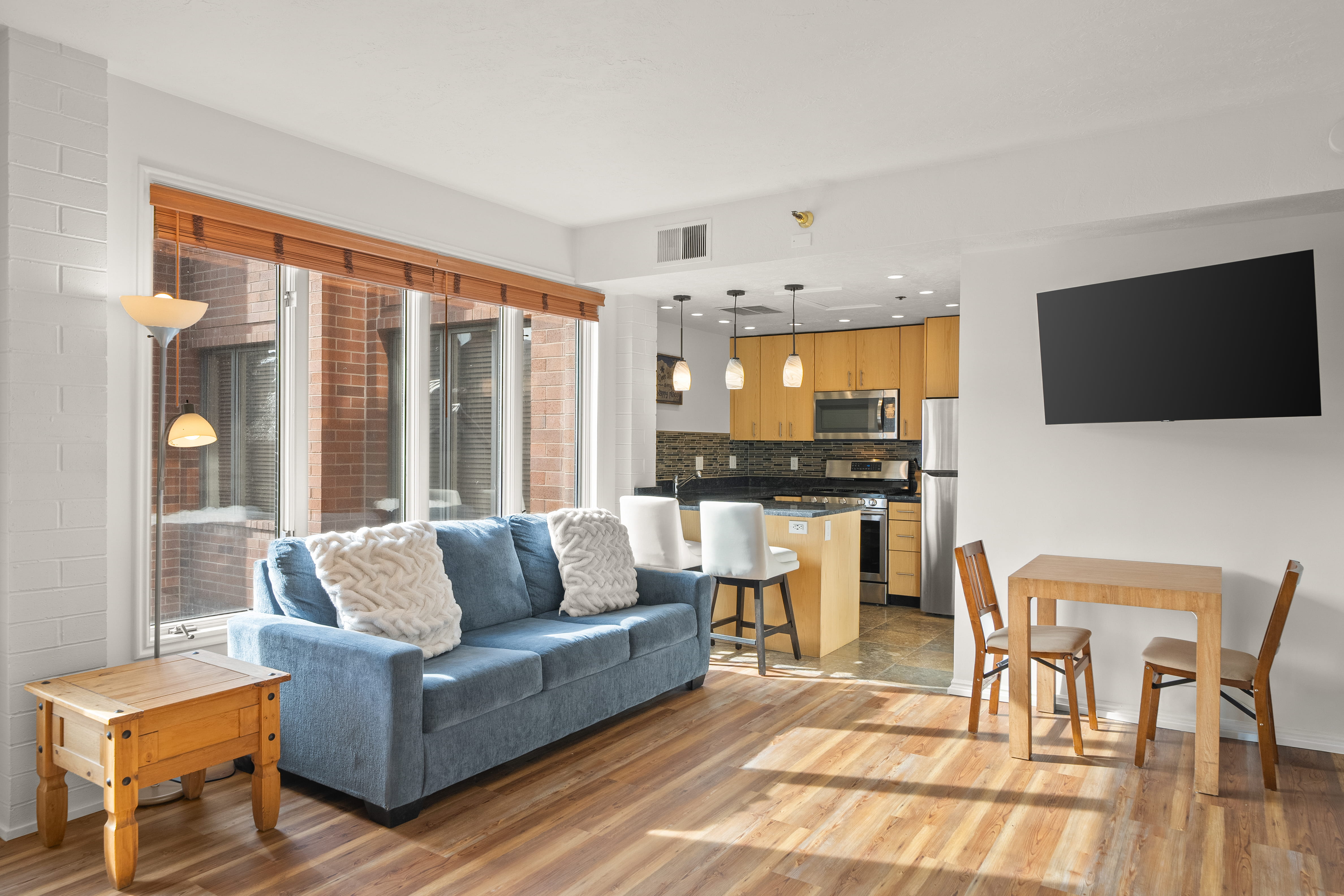 Living area with light wood-style floors and baseboards