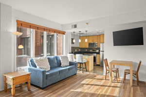 Living area with light wood-style floors and baseboards