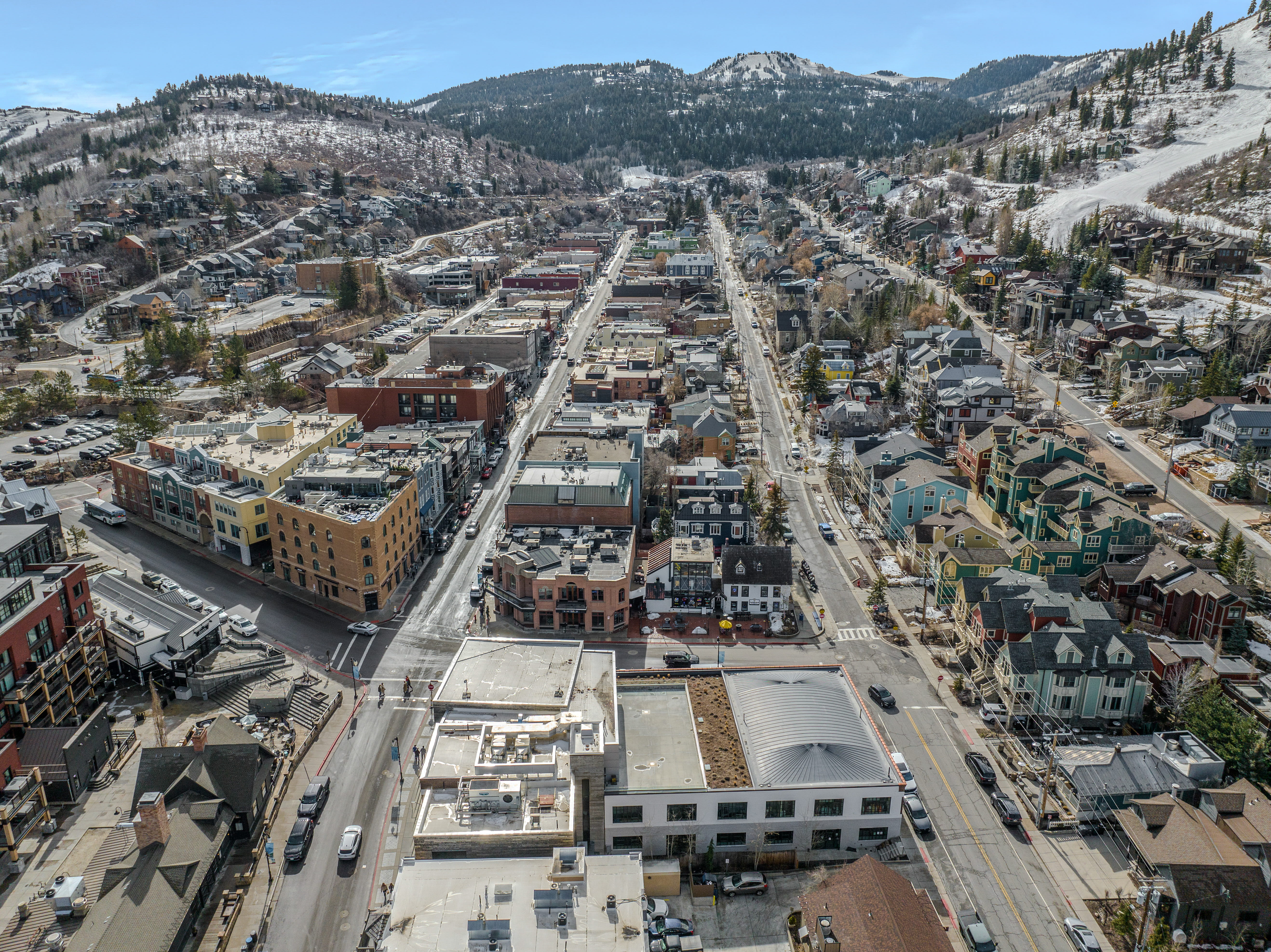 Aerial view of property's location with a mountainous background