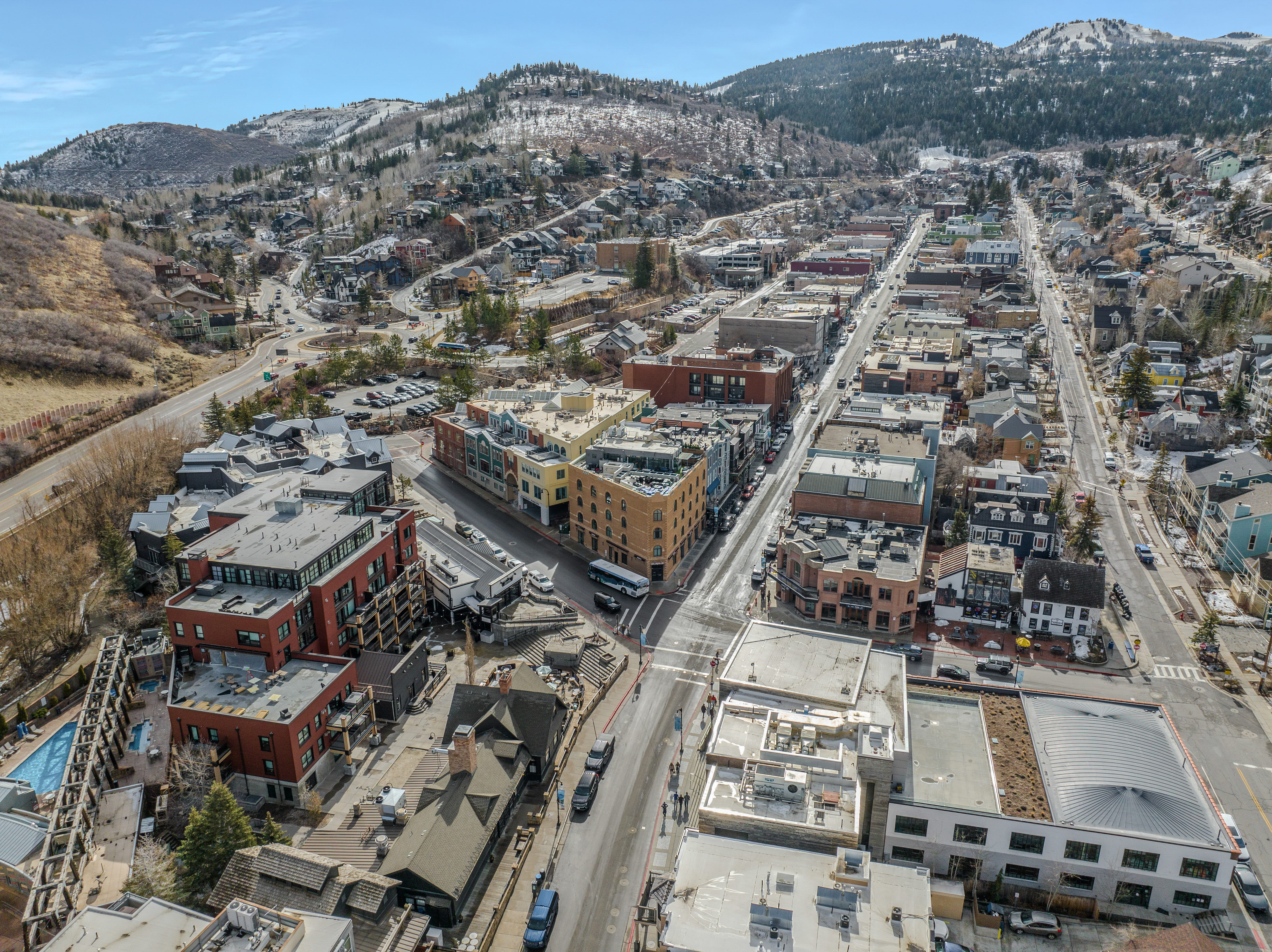 Aerial overview of property's location featuring a mountainous background